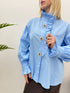 Camicia con volant e bottoni gioiello