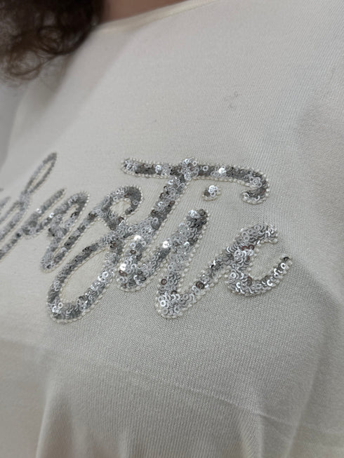 Maglia in tessuto rasato con scritta paillettes