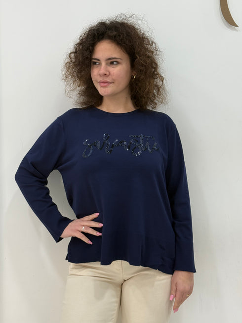Maglia in tessuto rasato con scritta paillettes