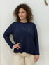 Maglia in tessuto rasato con scritta paillettes