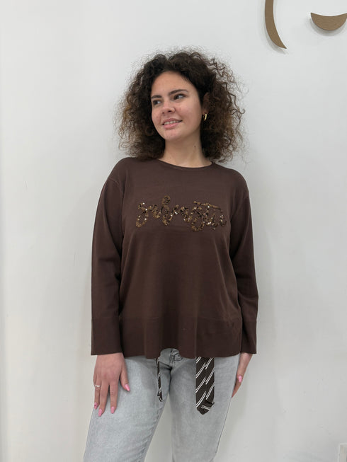 Maglia in tessuto rasato con scritta paillettes