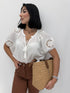 Blusa cotone con nappina