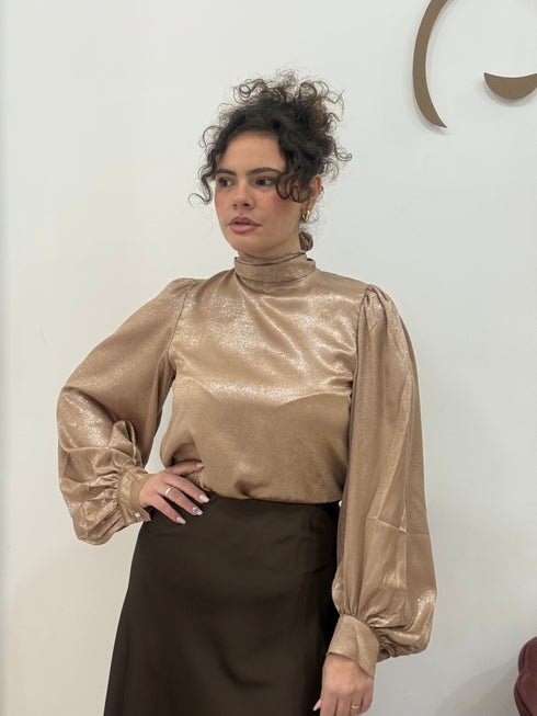 Blusa spalmata laminata