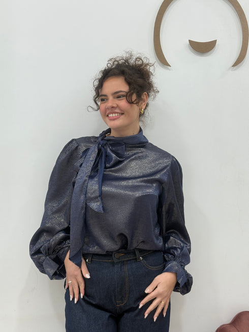 Blusa spalmata laminata