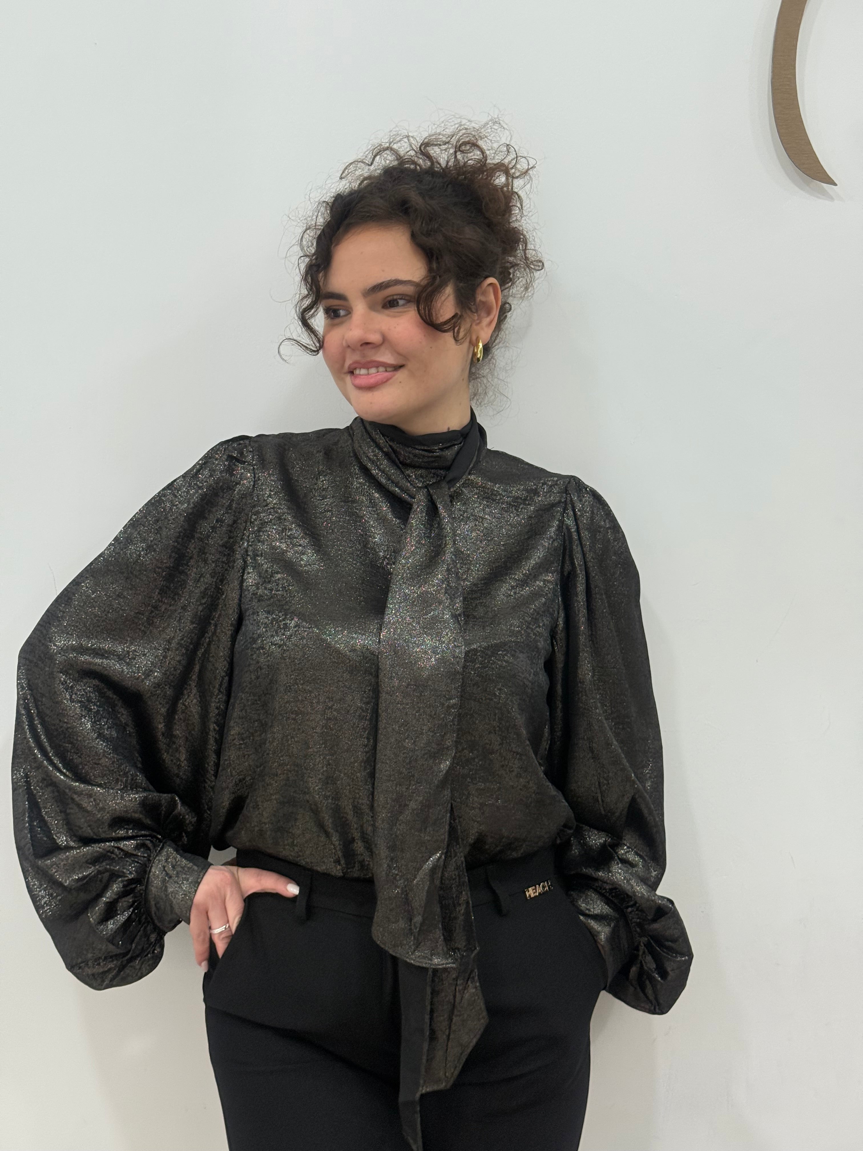 Blusa spalmata laminata